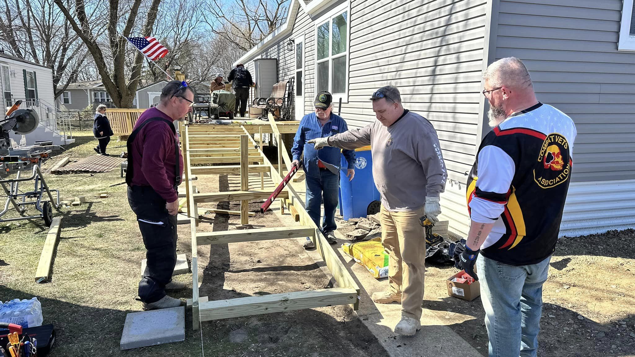 Members building a wheelchair ramp